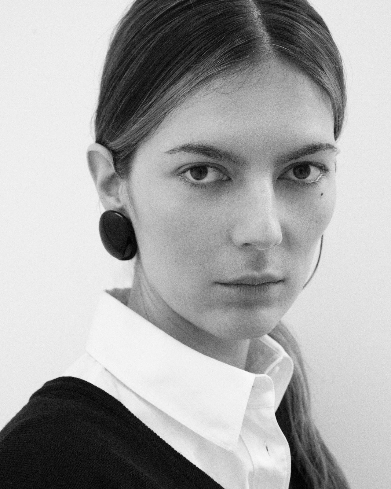 Camille Surault's BLOWBLOW earrings large in black resin, front view. 