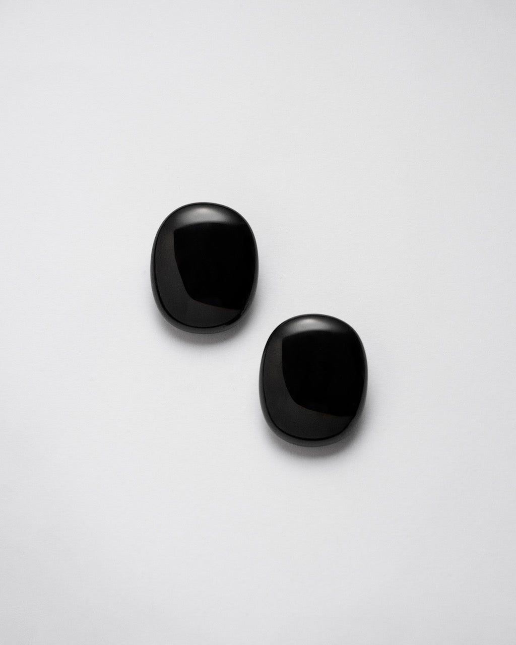 Camille Surault's BLOWBLOW earrings large in black resin, front view. 