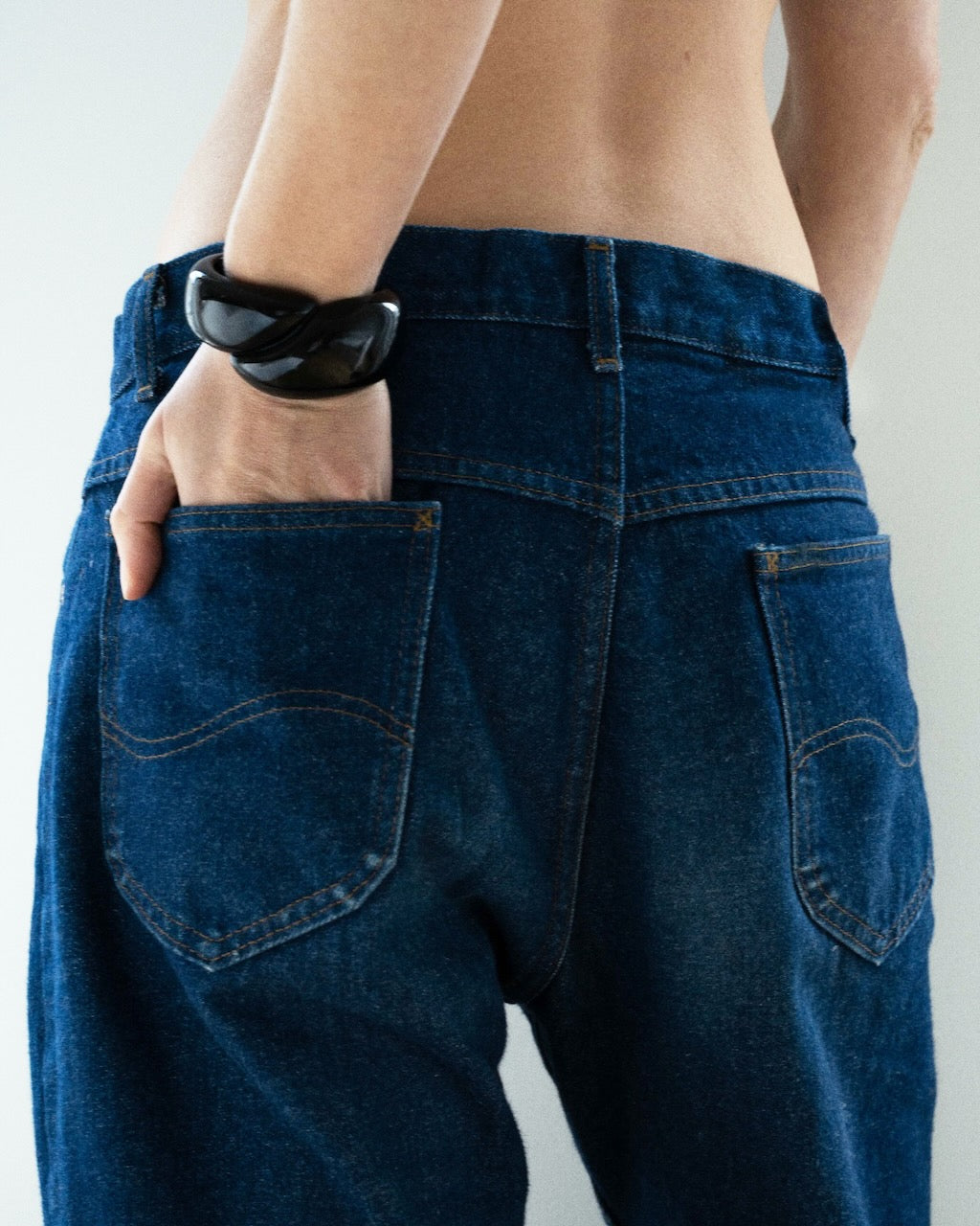 Camille Surault's DOWDOW bracelet in black resin worn on a wrist., 