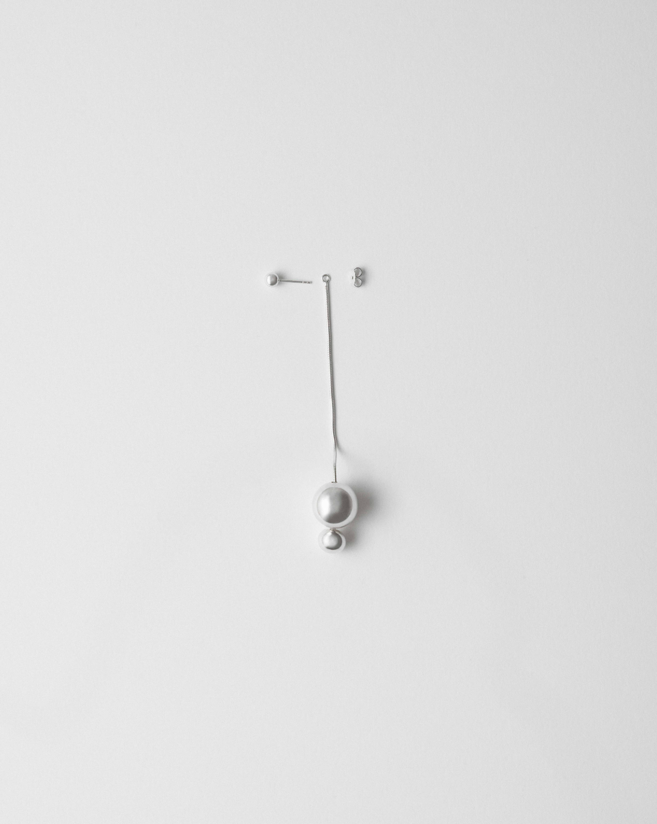 Camille Surault's Vada earrings long in sterling silver, side view. 